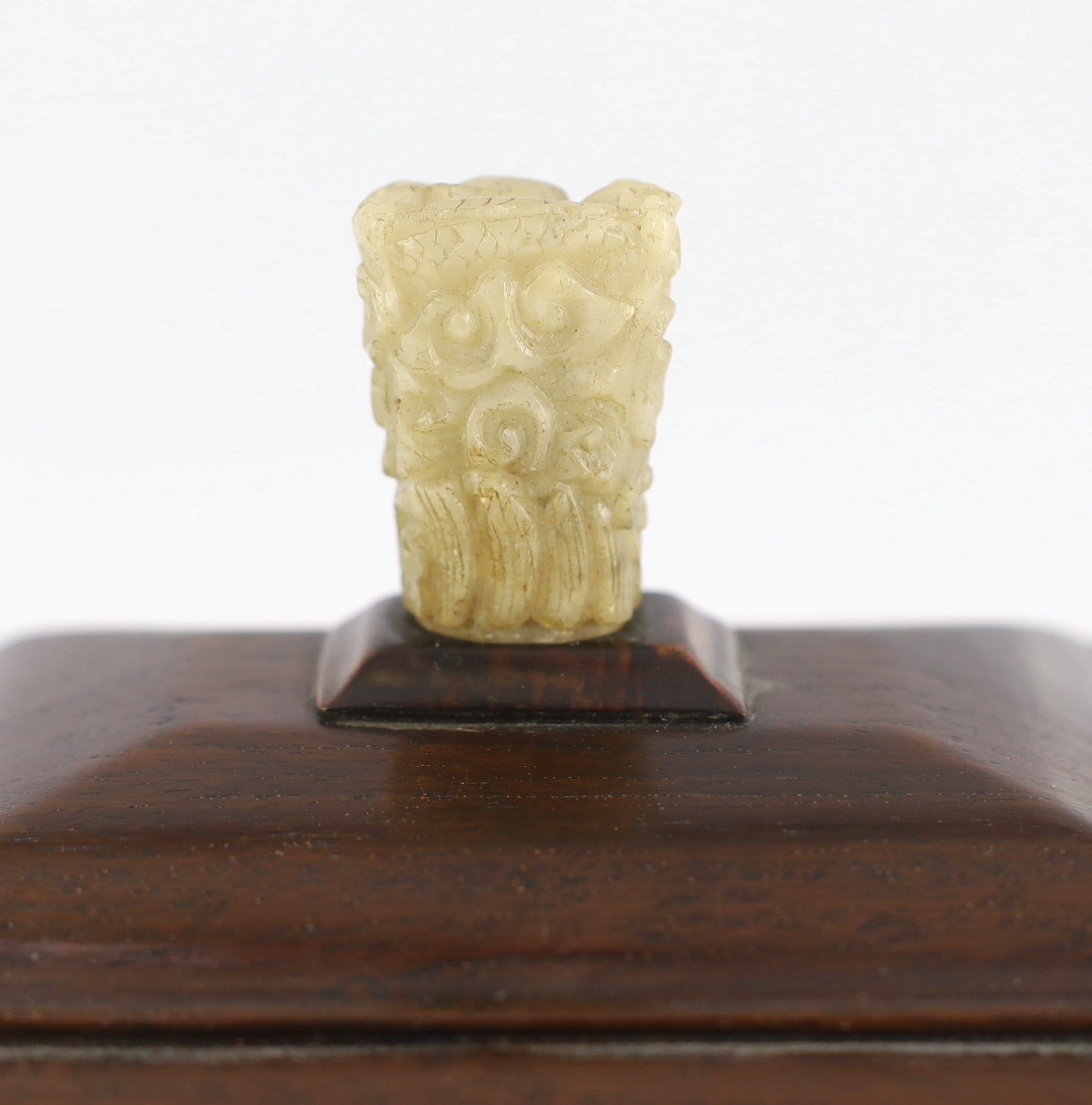 An early 20th century Chinese hongmu stand and cover with a 17th/18th century pale white jade finial